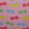 Coral Fleece – Colorful bows on pink