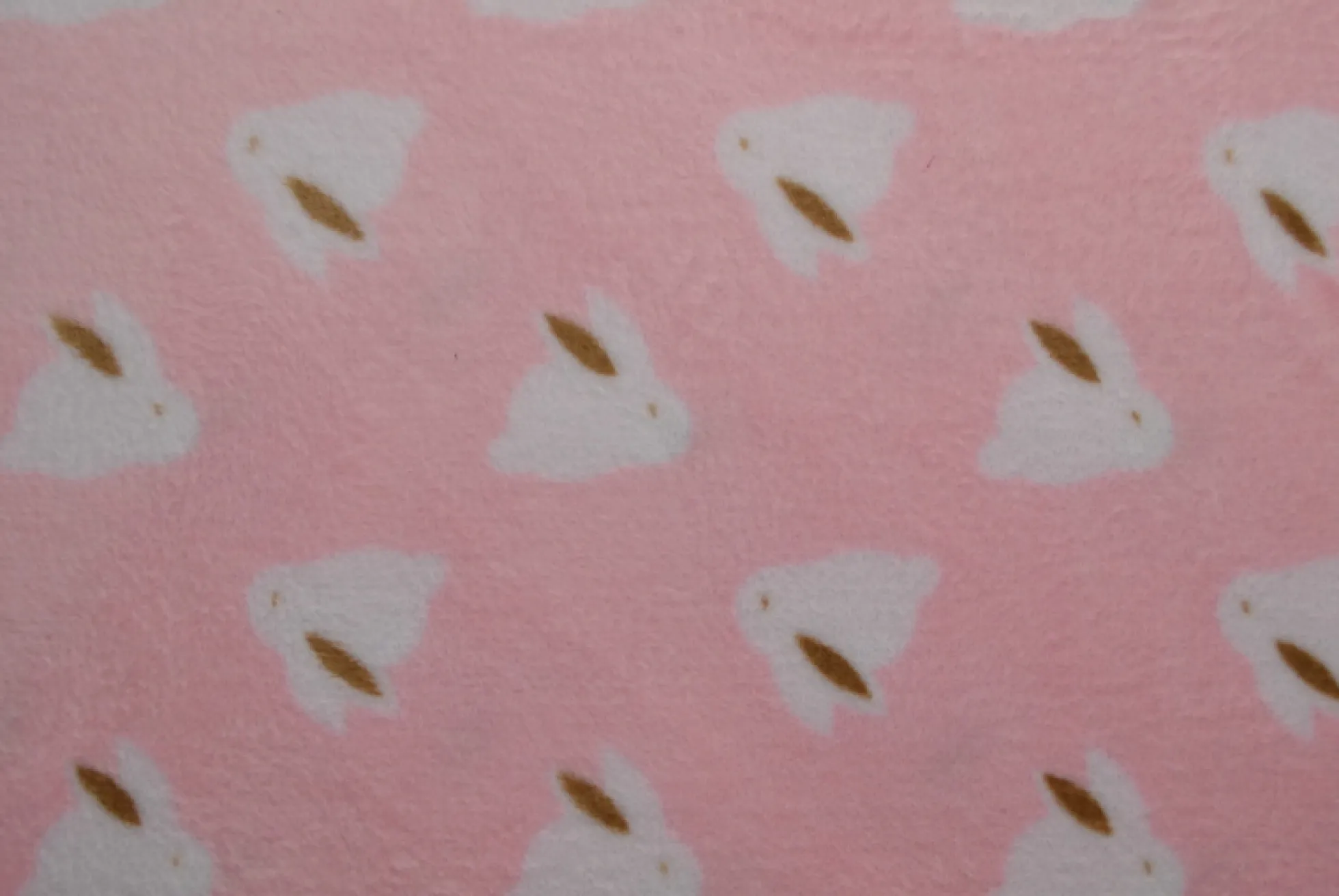 Coral Fleece – White rabbits on pink