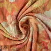 Fluweel stretch – Orange colored flowers crushed look