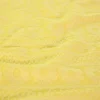 Jacquard jersey – Flower lines geel