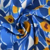 Katoen poplin  – Bladeren fantasie blauw en okergeel