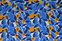 Katoen poplin  – Bladeren fantasie blauw en okergeel