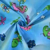 Katoen poplin – Happy dino on blue