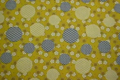 Katoen poplin – Oker bloemen en stippen