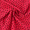 Lycra – Black dots on coral pink