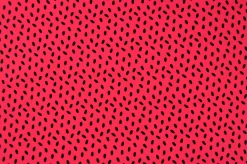 Lycra – Black dots on coral pink