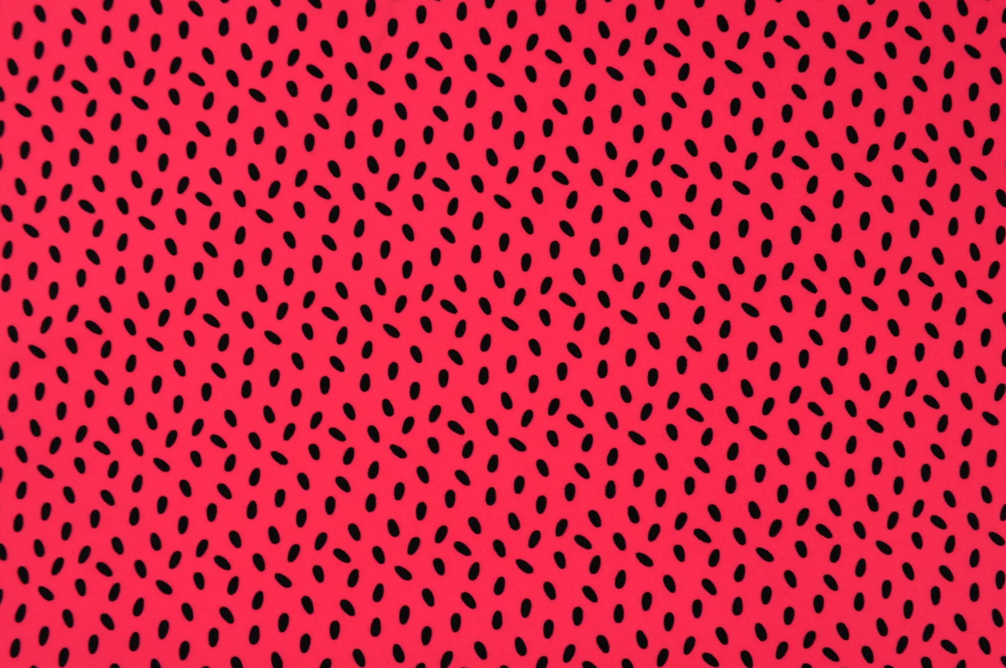Lycra – Black dots on coral pink