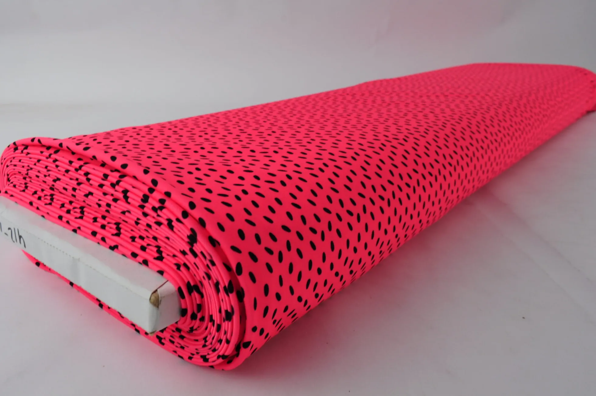 Lycra – Black dots on coral pink