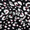Travelstof – Brown & white animals dots on black