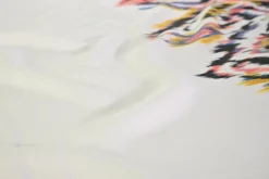 Viscose stretch crêpe – Kleurrijke ikat op gebroken wit randdesign